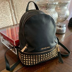 Michael Kors back pack w/black studs-good condt.